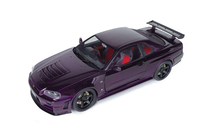 Top three-quarter view of purple 1:18 Nissan Skyline GT-R die-cast model with rear spoiler
