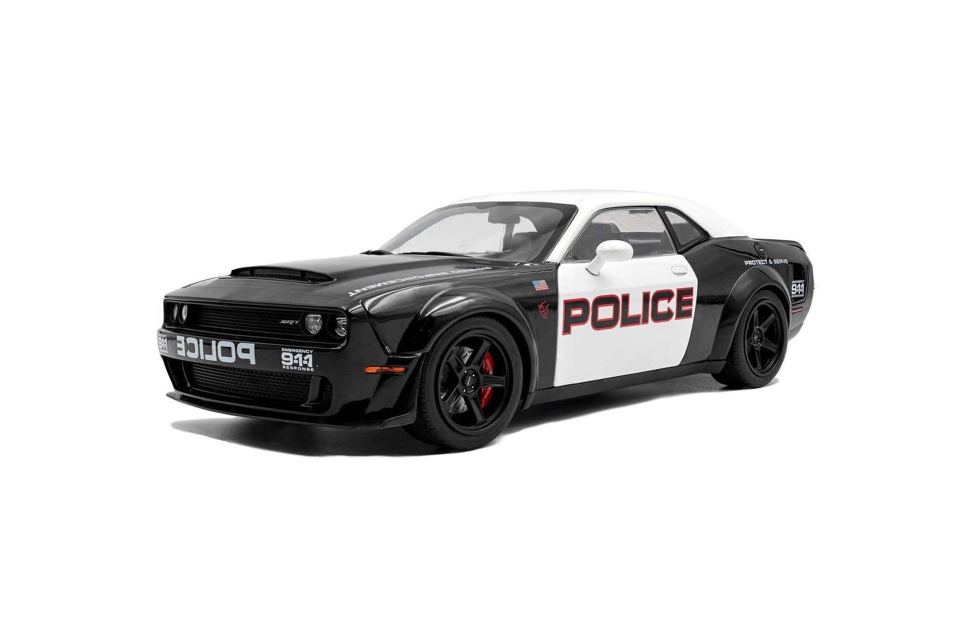 Black-and-white police die-cast car model, front three-quarter view