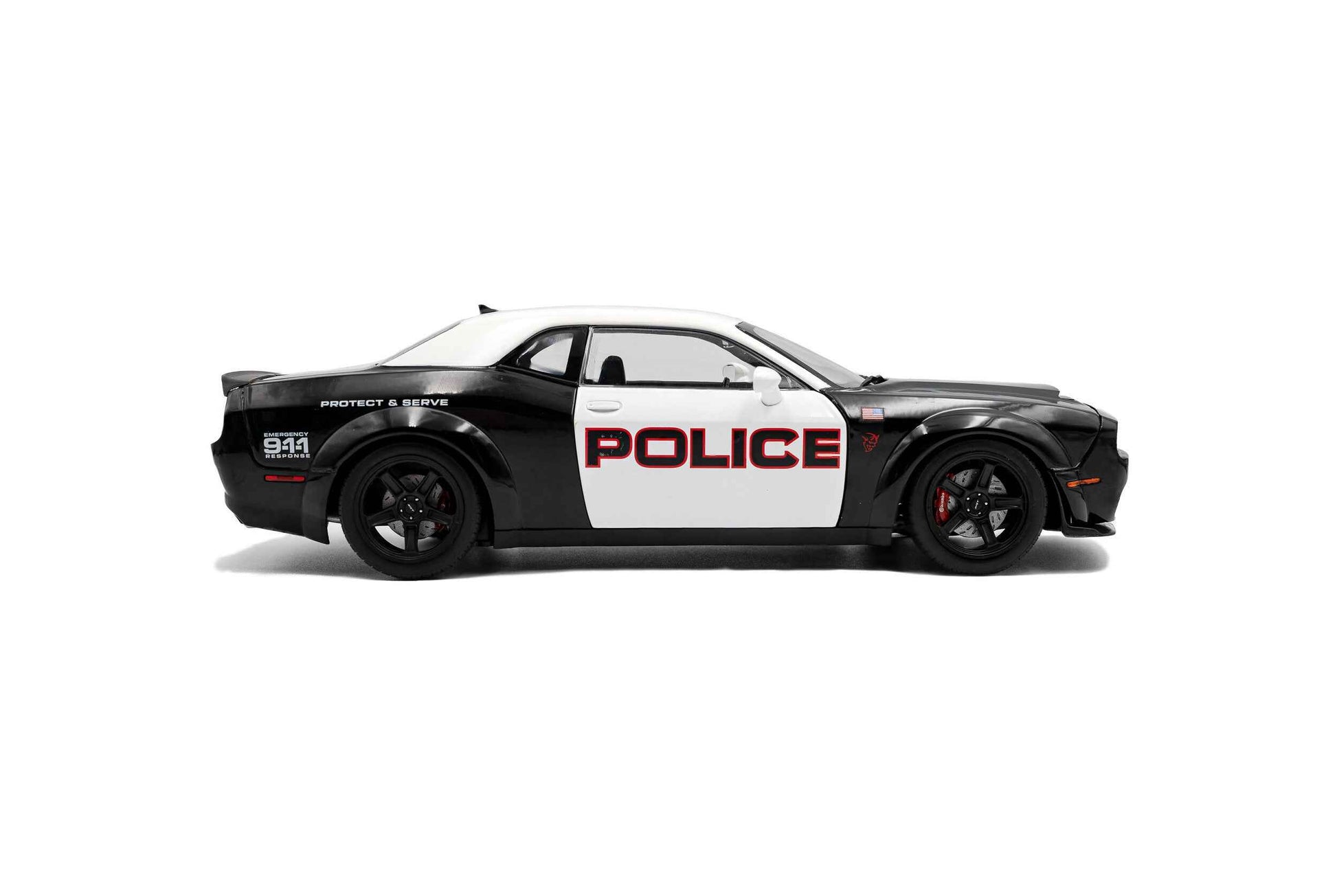 Black-and-white police die-cast car model, side view with POLICE and wheel details
