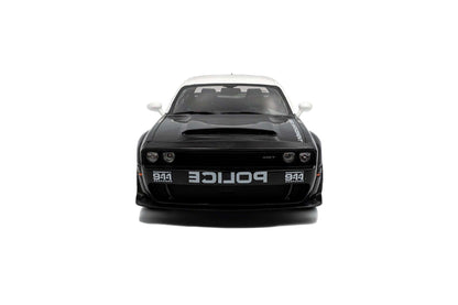 Black police die-cast car model, front view with grille and POLICE markings