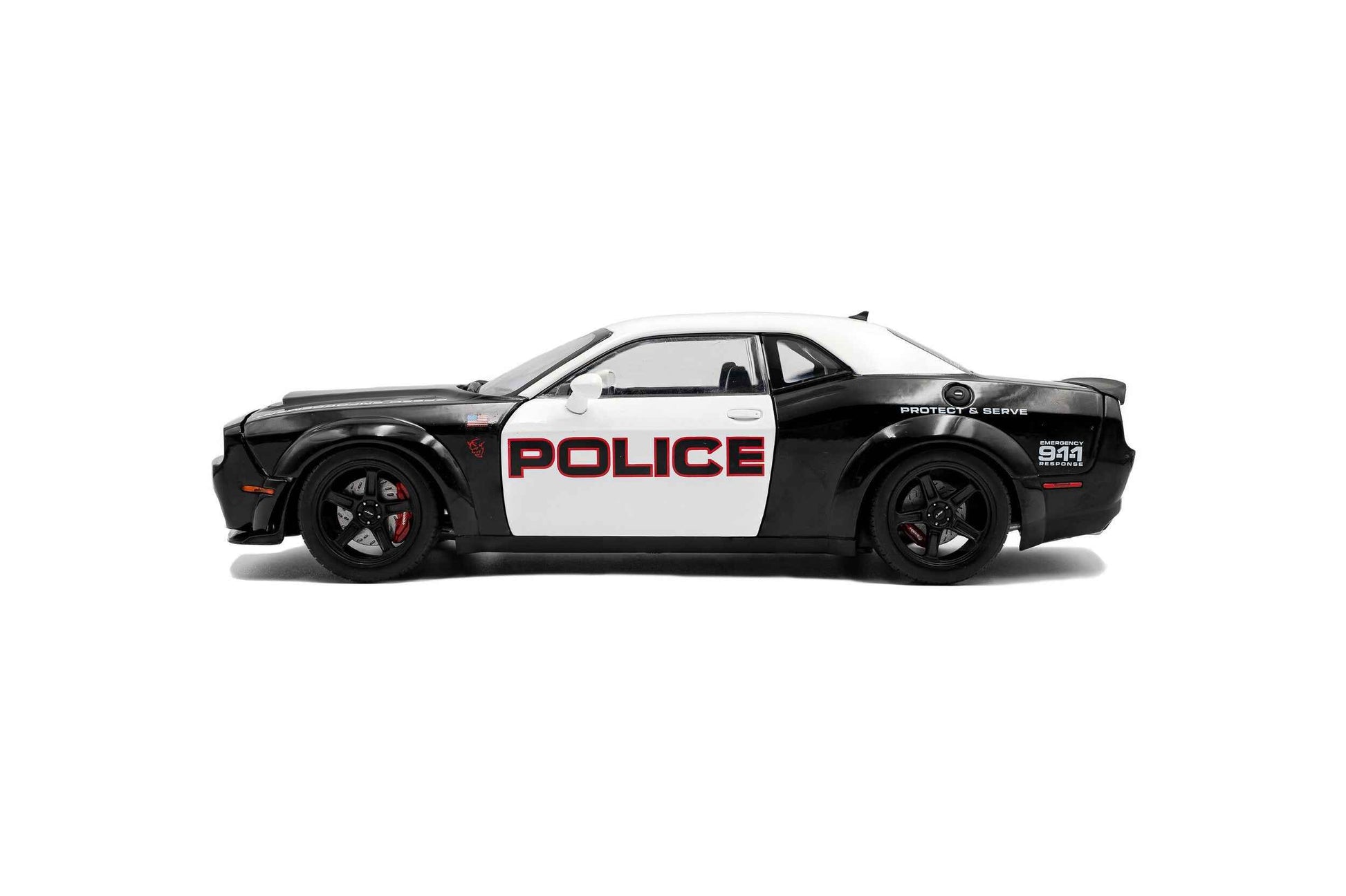 Black-and-white police die-cast car model, side profile with POLICE label