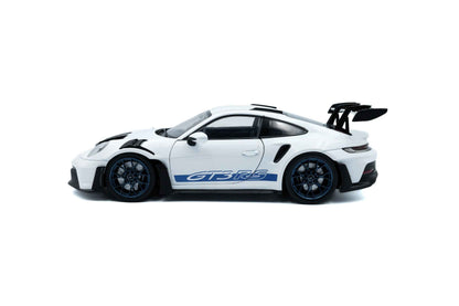 White 1:18 Porsche GT3 RS die-cast with blue GT3 RS decals, side profile