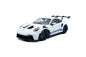 White 1:18 Porsche GT3 RS die-cast with blue side stripe and dark wheels, front 3/4 view
