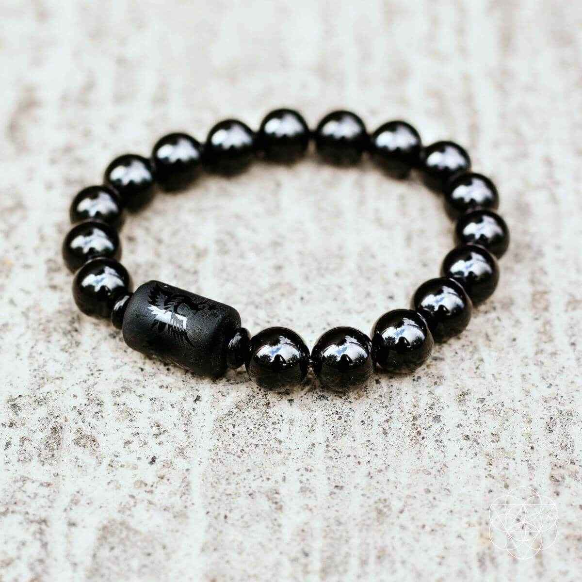 Black obsidian bead bracelet with smooth barrel charm center