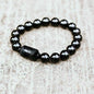 Black obsidian bead bracelet with smooth barrel charm center