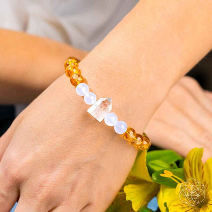 Gold and white beaded bracelet with crystal centerpiece charm