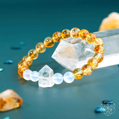 Gold beaded bracelet with white beads and faceted crystal charm