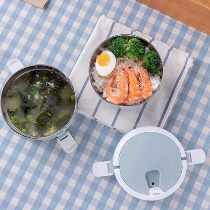 Light blue insulated bento lunch box with three open compartments and serving bowls