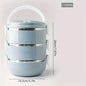 Light blue insulated bento lunch box with three stackable layers and side carrying clips