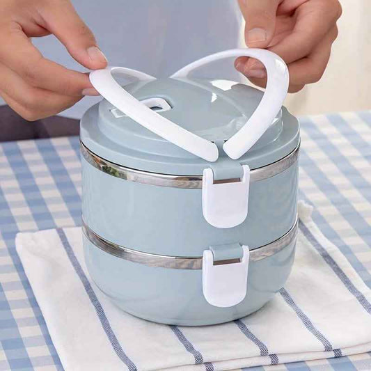 Light blue insulated bento lunch box with white carry handle and latch clips