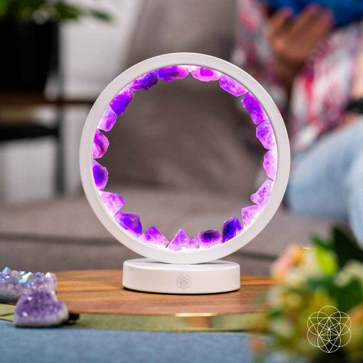 White amethyst healing lamp on base with purple crystal ring light glow