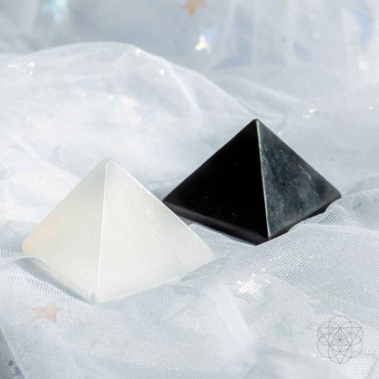 Black and off-white crystal pyramids on white mesh fabric