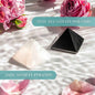 Anti-negativity crystal pyramid, black and off-white with triangular facets