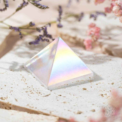 Iridescent angel aura crystal pyramid on white stone