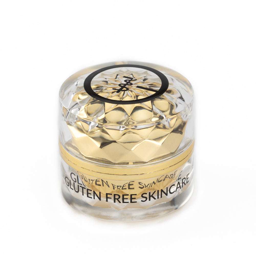 Gluten-free eye cream jar with clear lid and gold embossed insert