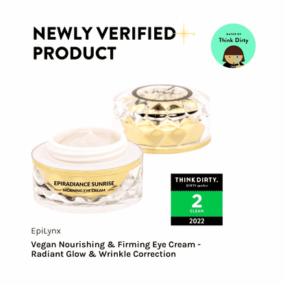 Eye cream jars, one open with pale pink cream and one sealed with gold lid