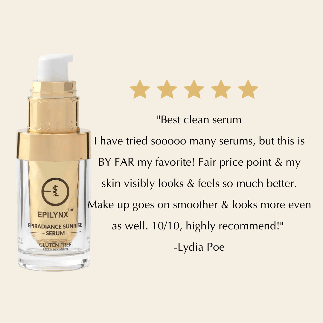 Serum bottle with gold pump top and clear glass body, gold label accents