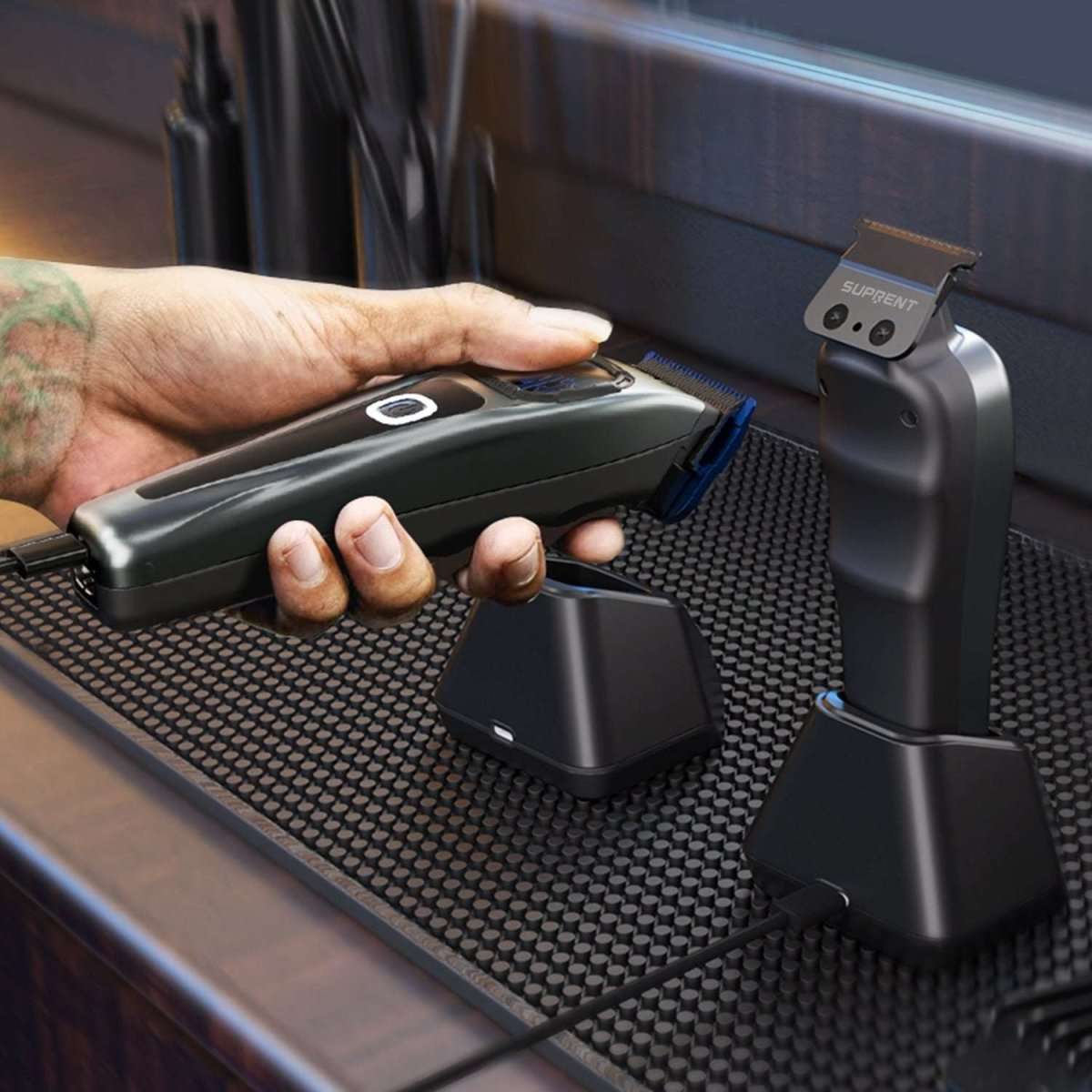 Hair clipper and trimmer resting on grooming mat with charging dock and case