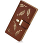 Brown leaf bifold wallet with cutout leaf pattern and snap strap closure