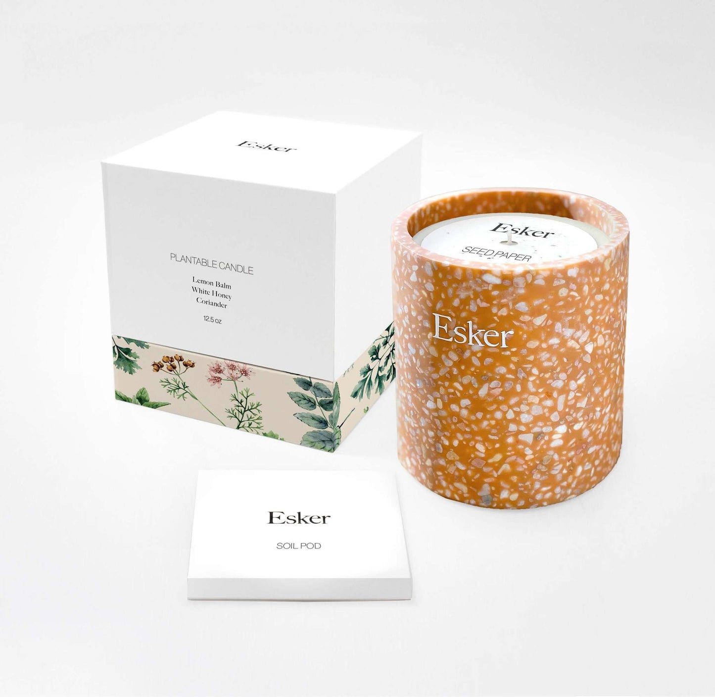 Plantable terracotta candle with Esker label, shown with gift box and instruction card