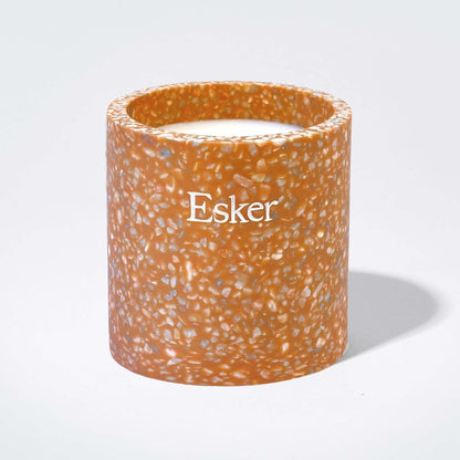 Plantable terracotta candle with Esker label, open top and visible wick