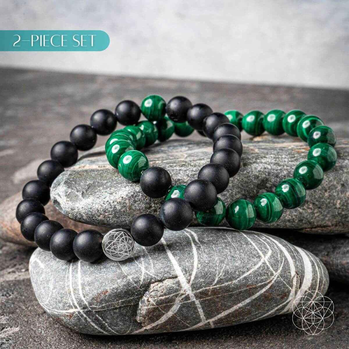 Double beaded bracelet set with black matte beads, green stone beads, and geometric charm