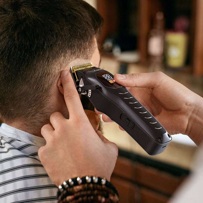 Black electric hair clipper cutting short hair near the scalp with guard comb