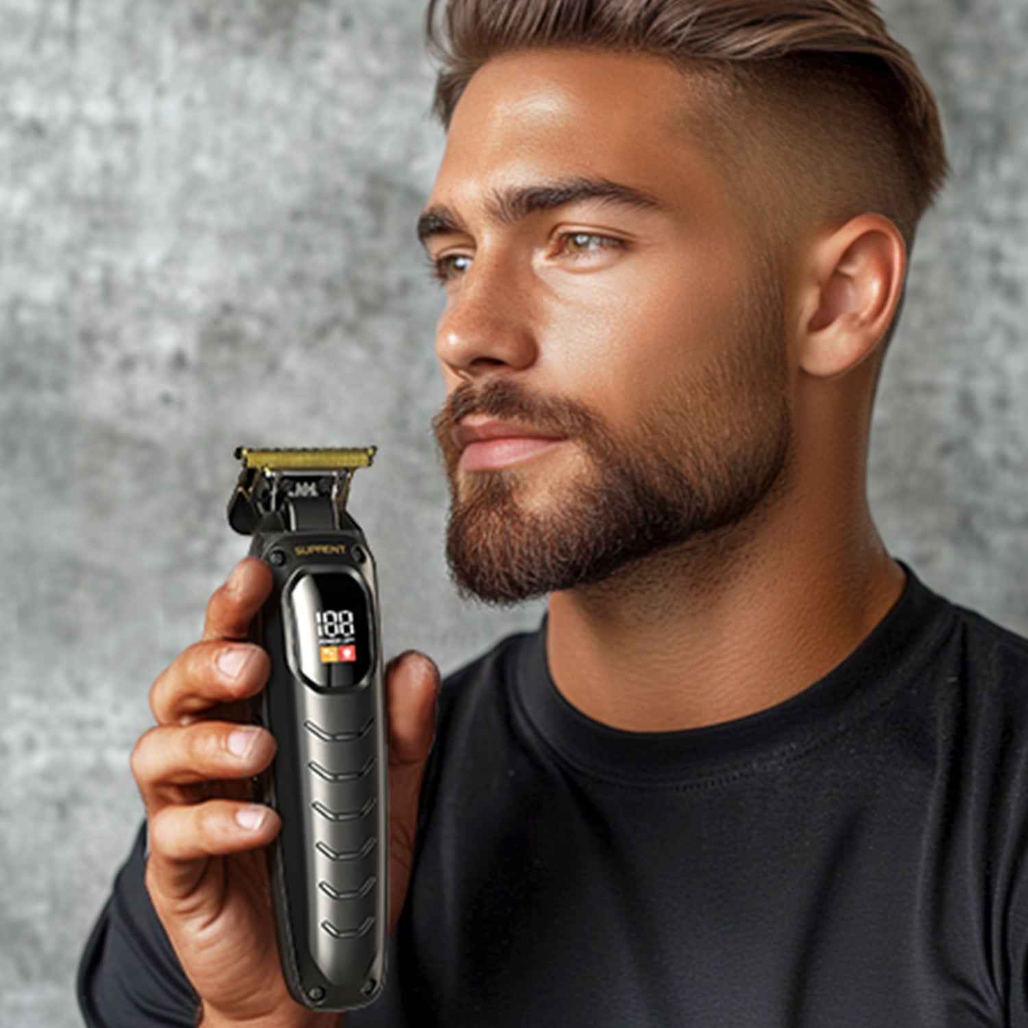 Black Scorpion trimmer with guard and display, held in hand