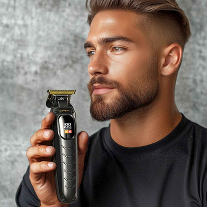 Black Scorpion trimmer with guard and display, held in hand