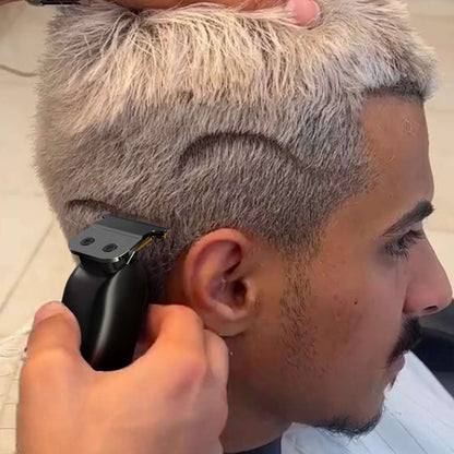 Black hair trimmer trimming a faded haircut on the side of the head