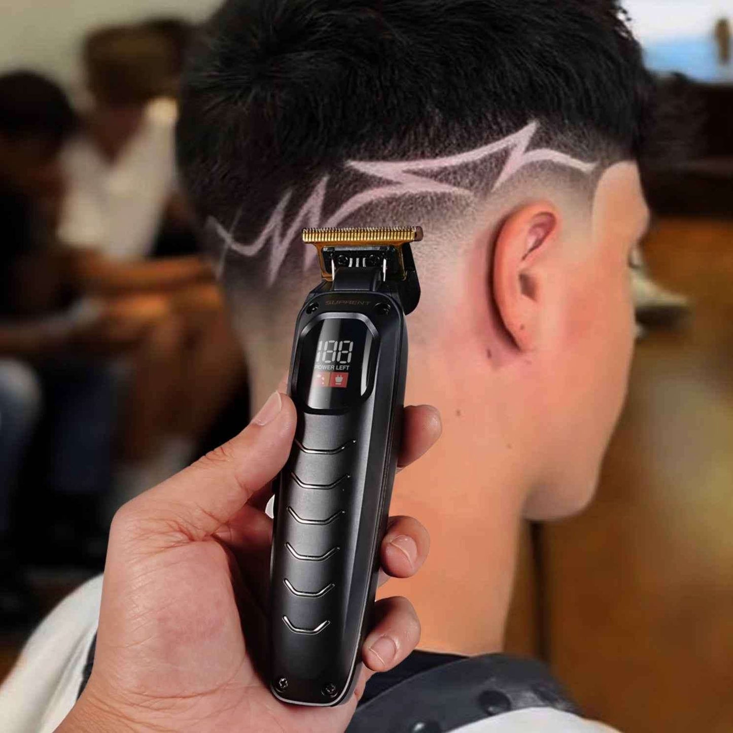Black Scorpion grooming trimmer with adjustable guard, held near cheek