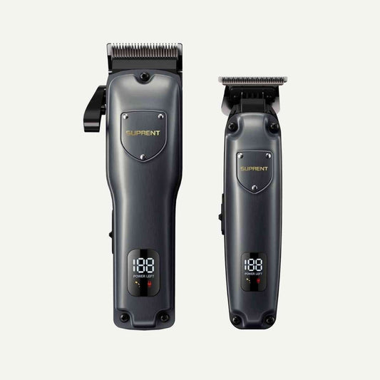 Two hair clippers in dark gray with toothed blades and LED battery display