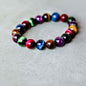 Bracelet of Resolve beaded bracelet with multicolor round stones in a circle pattern