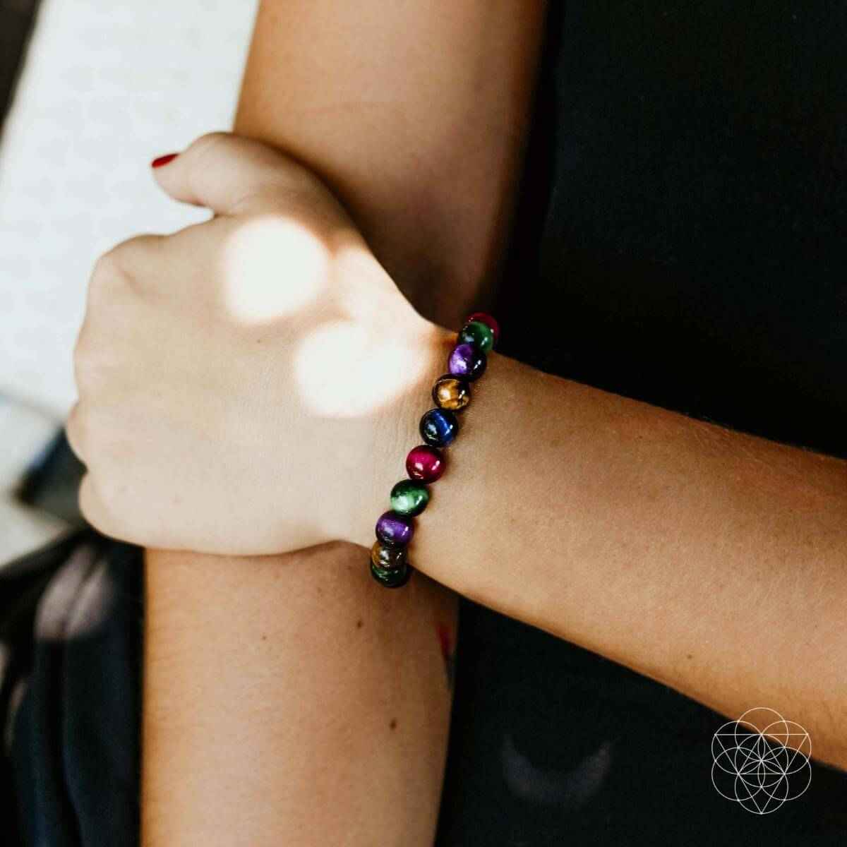 Colorful beaded bracelet on wrist, multicolor round beads with a flexible stretch fit