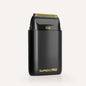 Professional foil shaver with black body and gold cutting head, for hair use