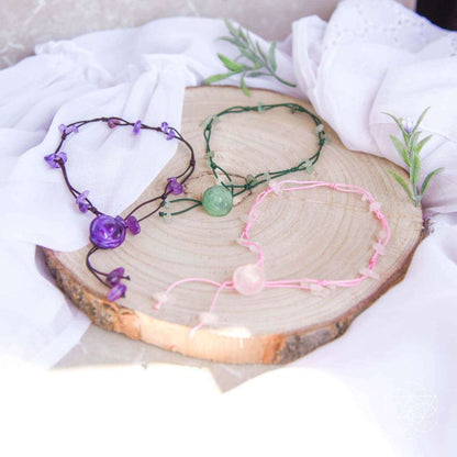 Set of purple and pink beaded anklets with round stone center charms and ties