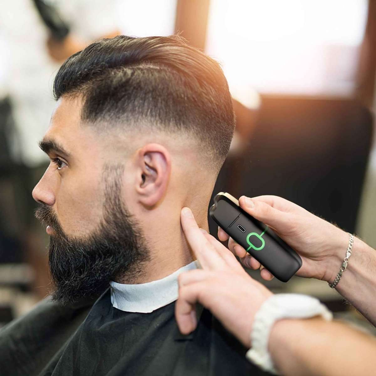 Electric foil shaver used on a man’s neck and cheek with beard