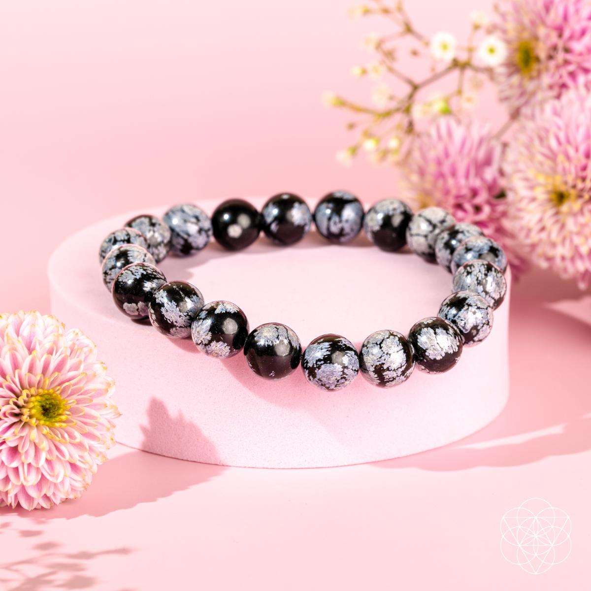 Snowflake obsidian bracelet with alternating black and gray speckled round beads
