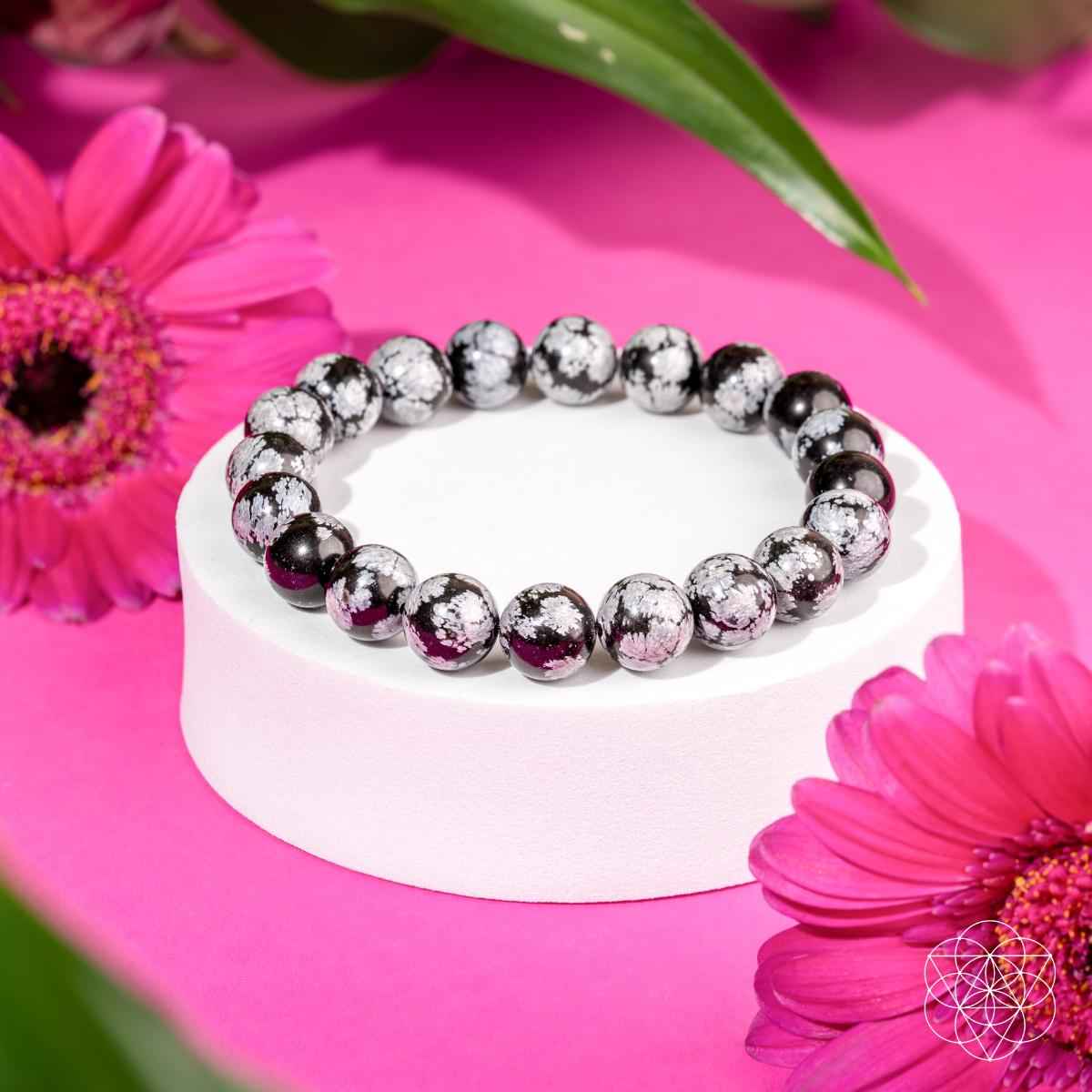 Snowflake obsidian beaded bracelet with black and gray speckled round stones