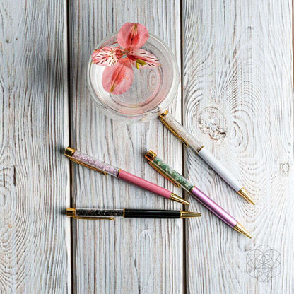 Crystal self-cleansing pen trio: pink, green, and gold-accented black barrels.