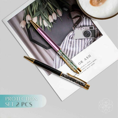 Crystal self-cleansing pen set with pink and green pens, gold caps and tips.
