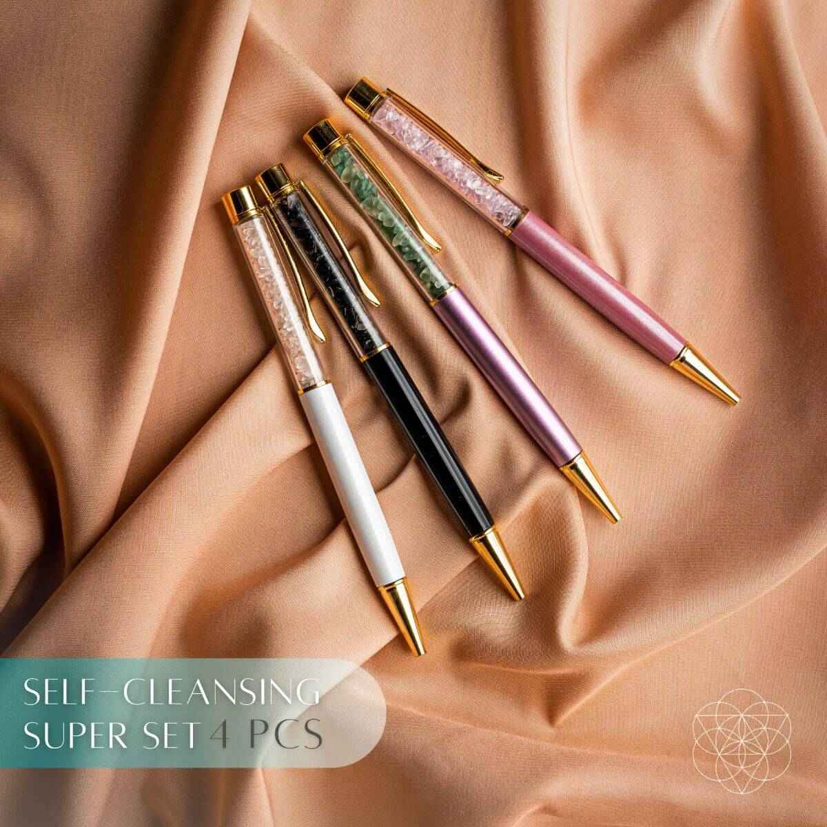 Crystal self-cleansing super set of four pens: pink, green, black, and white barrels.