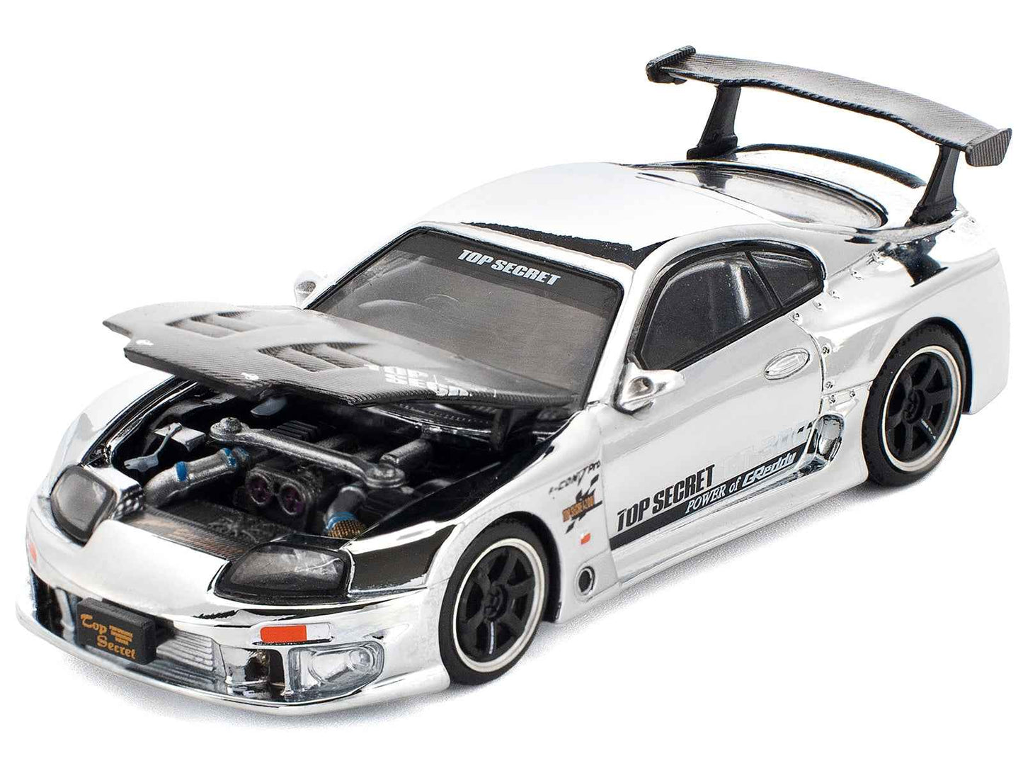Silver and black Toyota Supra diecast race car with open engine bay and front decals