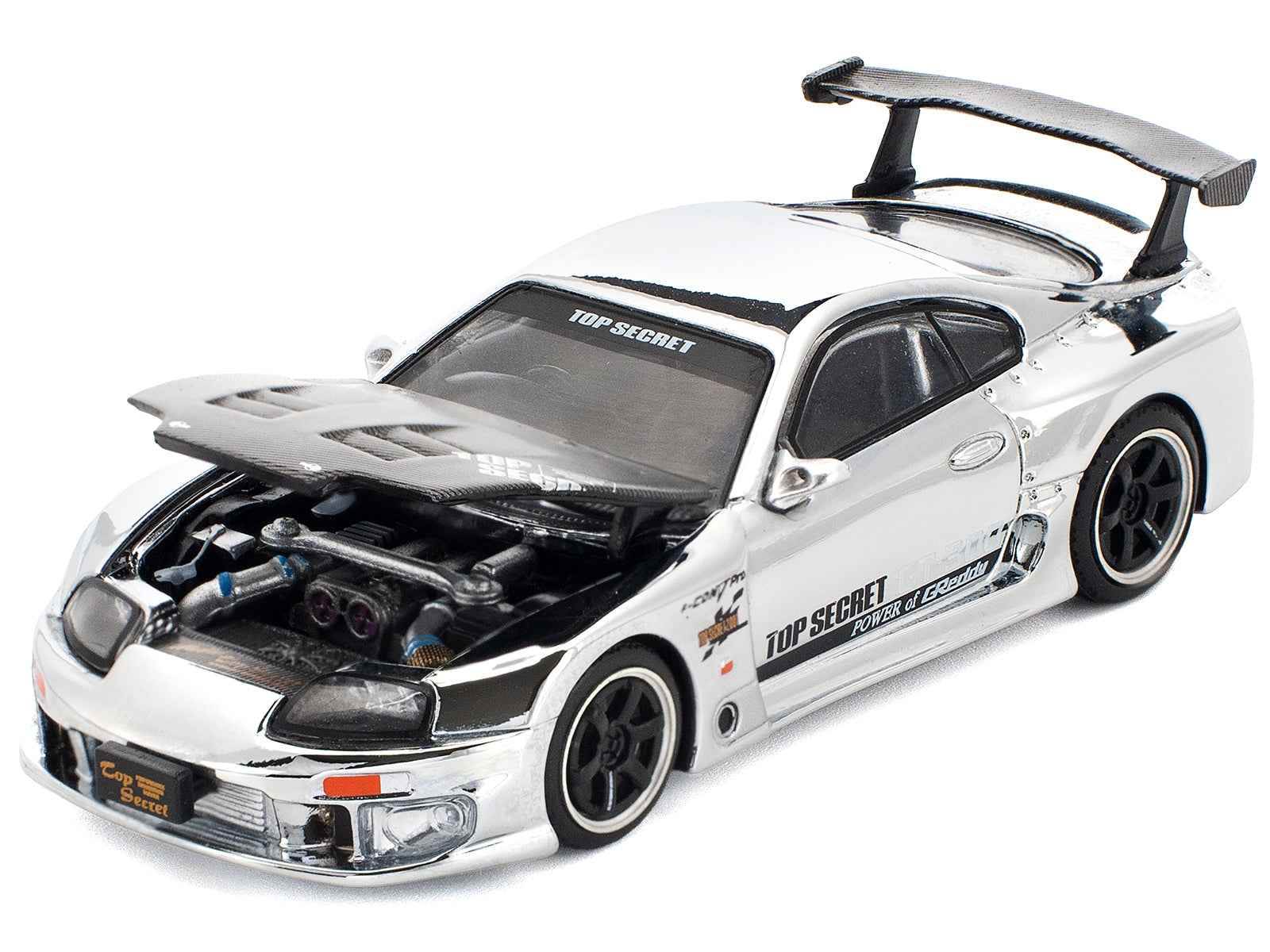 Silver and black Toyota Supra diecast race car with open engine bay and front decals