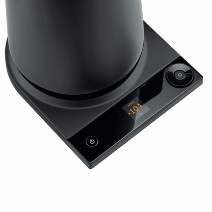 Matte black electric Turkish tea maker base with circular control button and display