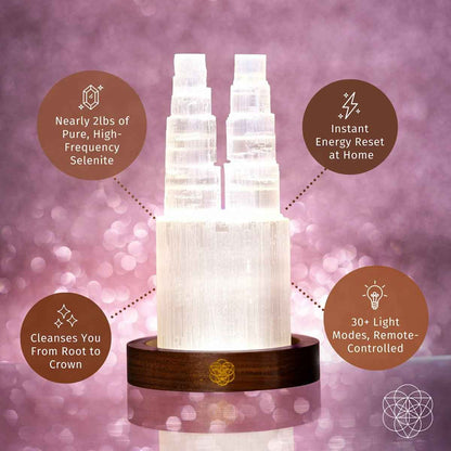 Two-tower selenite lamp with two glowing crystal columns on round wooden base