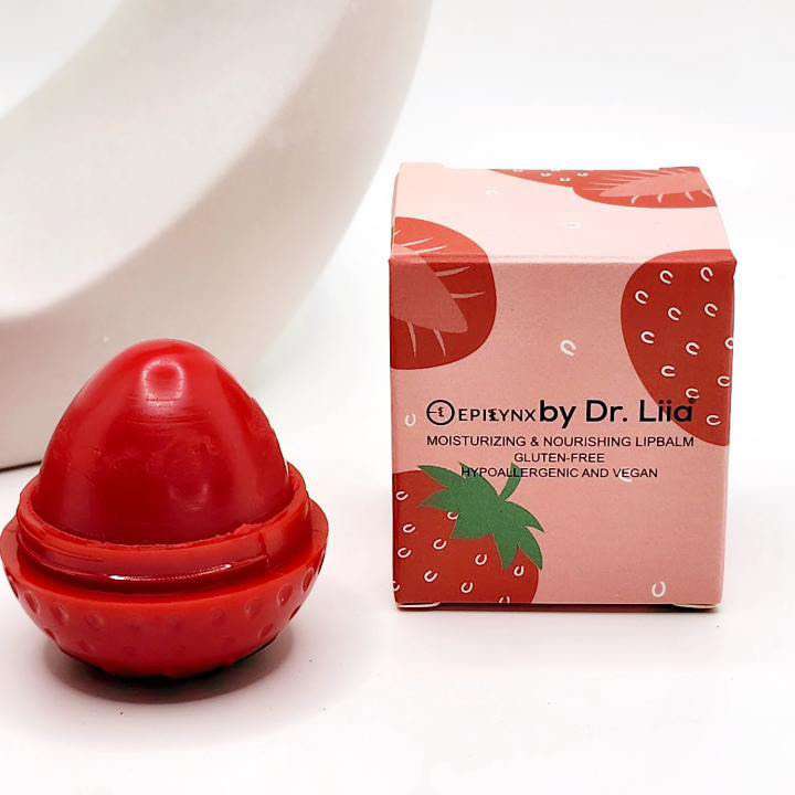 Red strawberry-shaped lip butter with matching product box by Dr. Lia.