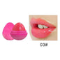 Pink lip butter balm in round shell with dome applicator; glossy pink lips swatch