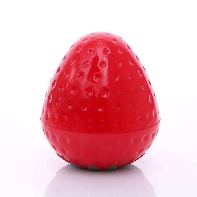 Red strawberry-shaped lip butter balm dome with small seed-like details