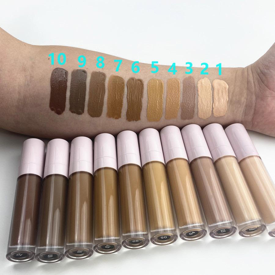 Matte concealer swatches on arm with multiple doe-foot applicator tubes